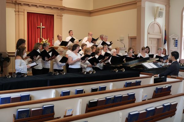 The choir sings for their beloved director.